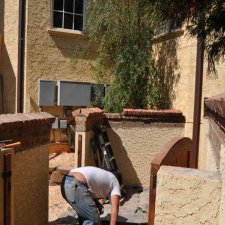 Brick wall and gate entryway under construction