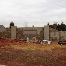 Stone entry wall under construction at residential development