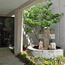 Paver driveway construction in progress in front of residential home