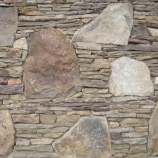Stacked stone veneer wall (close-up, large stones)