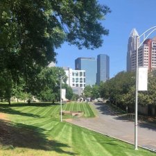 Commercial property with professionally striped lawn in city landscape